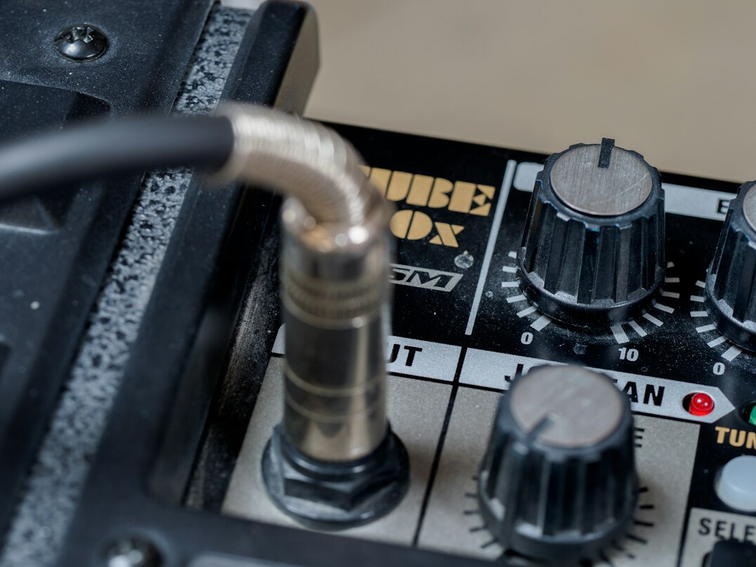Boom microphone held above a studio set by a sound technician