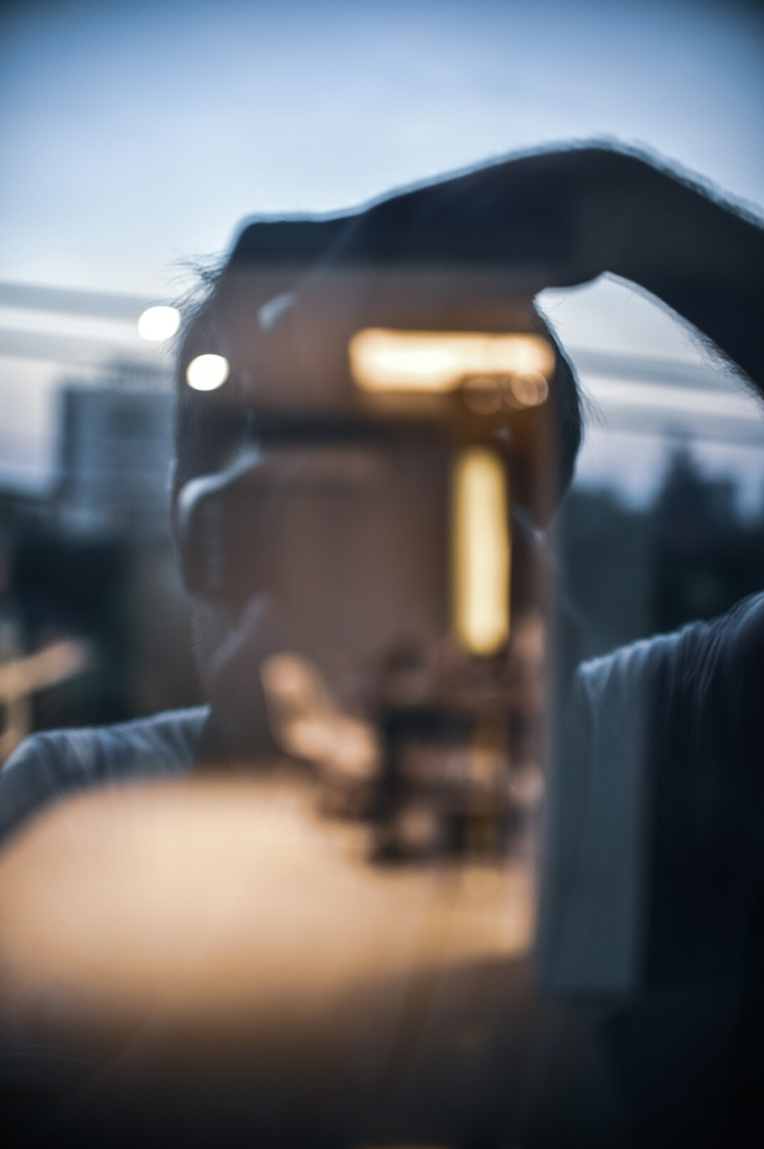Hands on the pan and tilt head of a studio pedestal camera